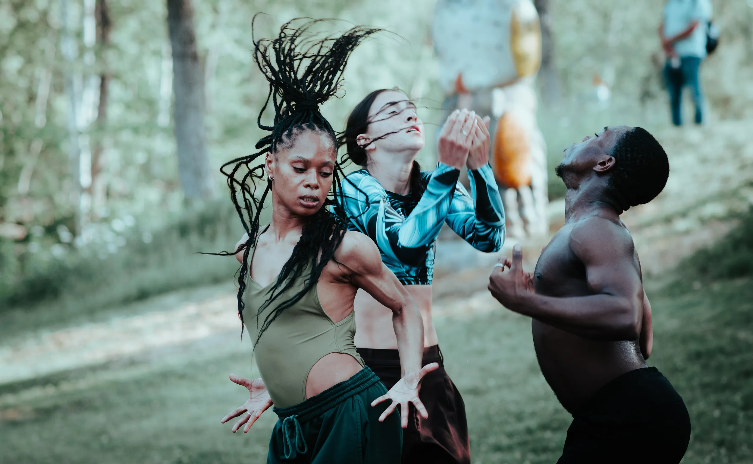 Three dancers performing outdoors at TurnPark Art Space